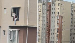 Schwindelerregende Höhe: Mädchen balancieren auf schmalem Sims an Hochhaus in China