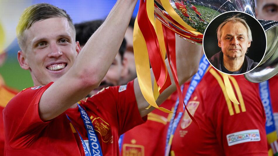 Spaniens Dani Olmo präsentiert stolz den gewonnenen EM-Pokal