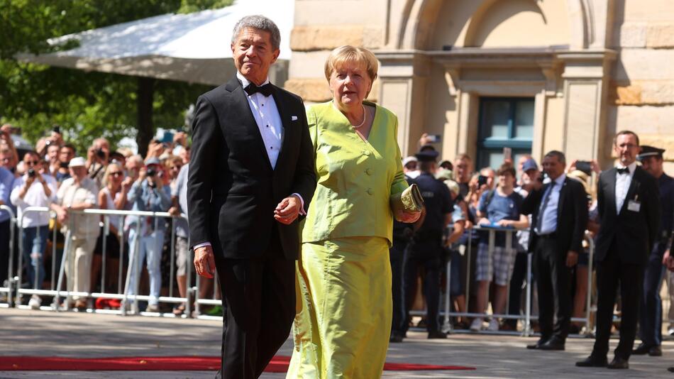 Joachim Sauer und Angela Merkel